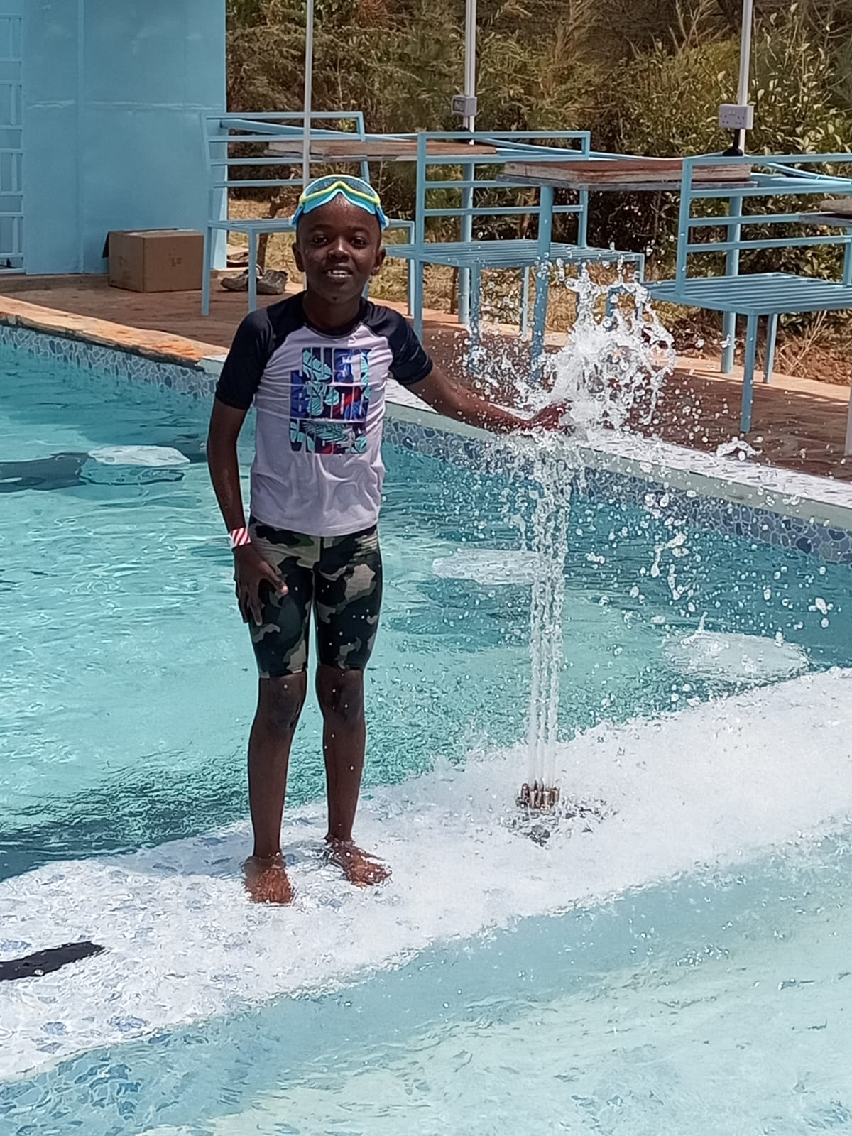A boy at the pool at Sidai Resort